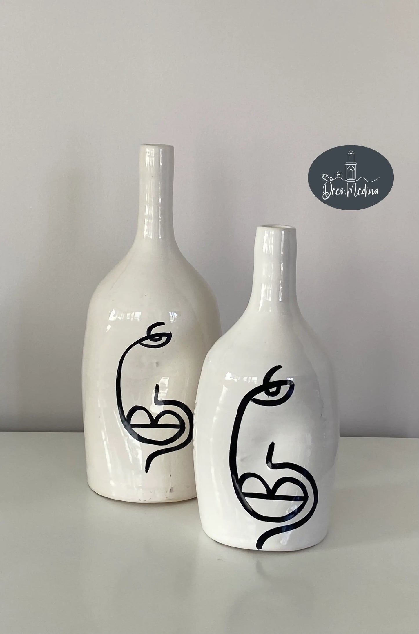 Vases motif visage